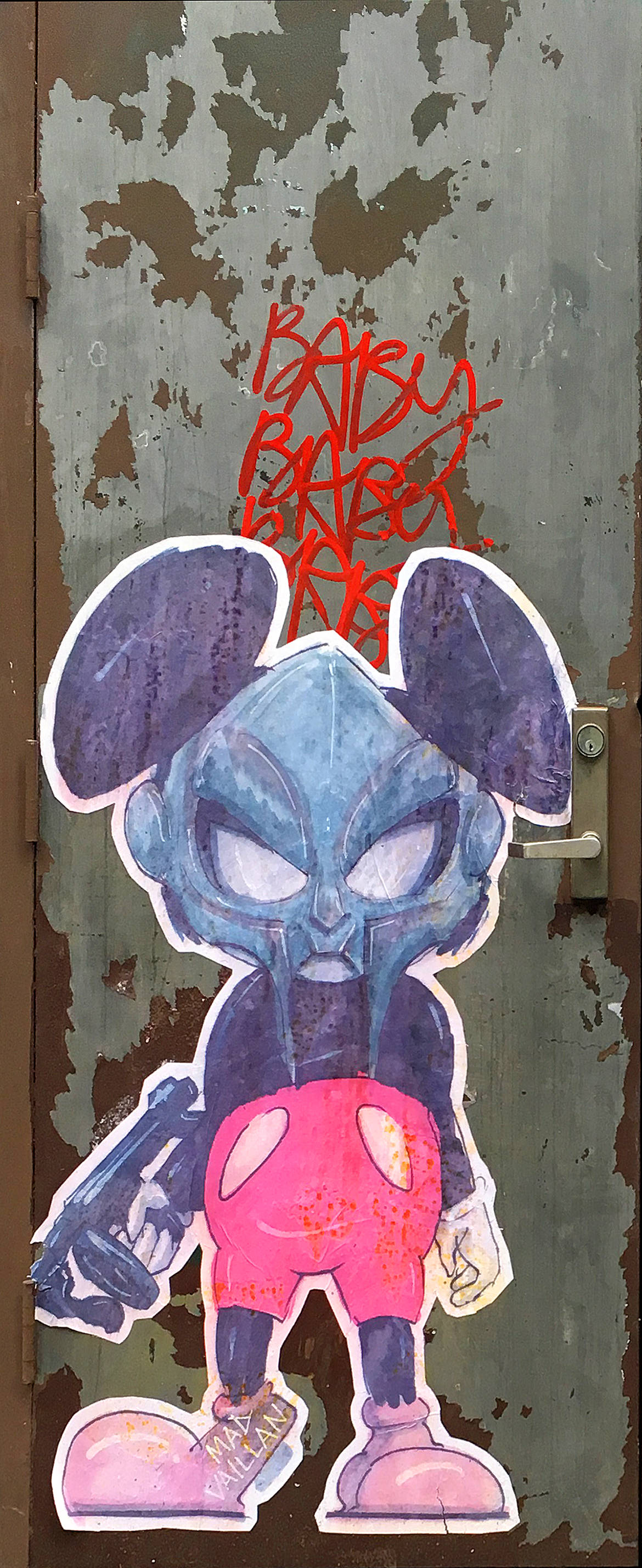 Paste up illustration of an evil Mickey Mouse