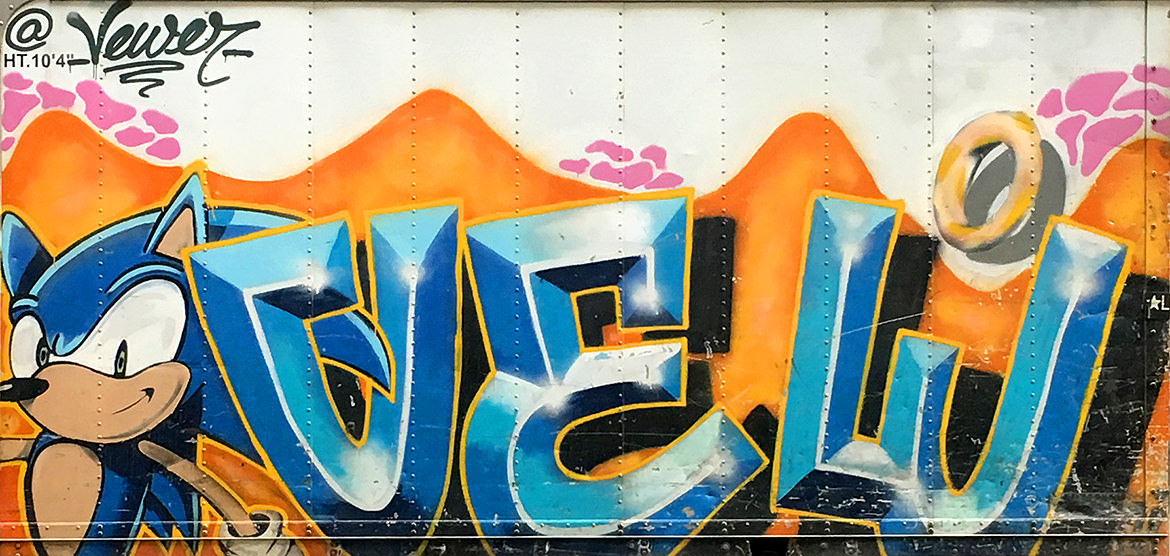 graffiti lettering with a spray paint illustration of Sonic the Hedgehog
