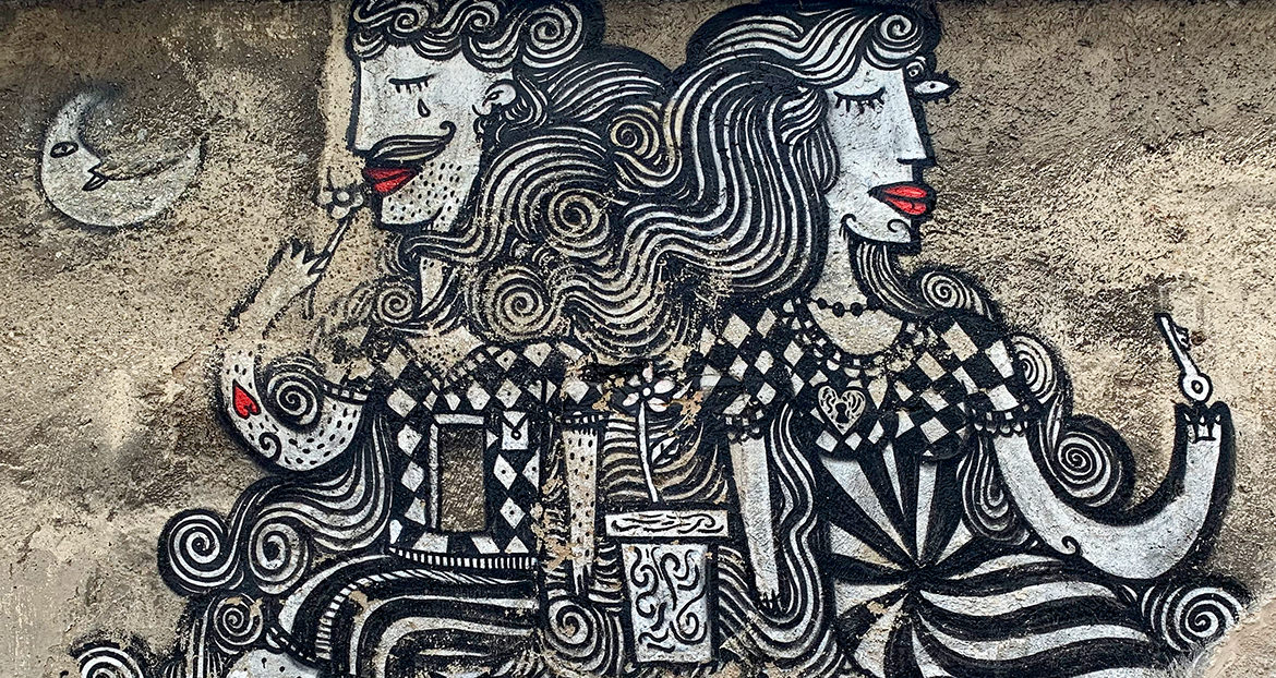 Cubist inspired street painting of a man and woman looking away from each other