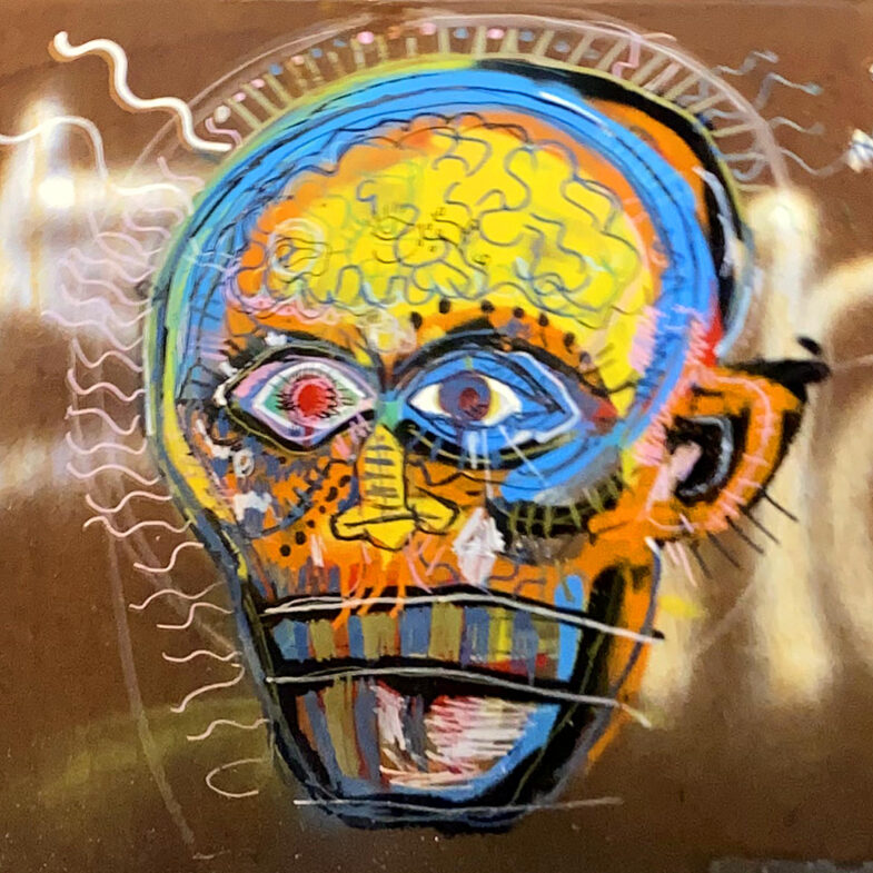 Street art graffiti of a colorful hand drawn person with their yellow brains showing through their skull. The style is very rough with loose brush strokes and overlayed line work.