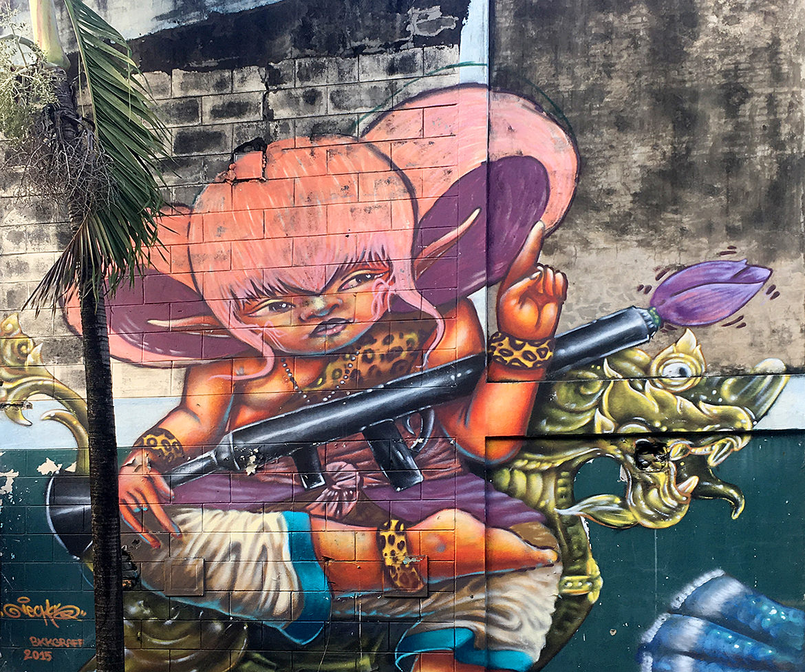 graffiti mural of a cartoon girl holding a rocket launcher