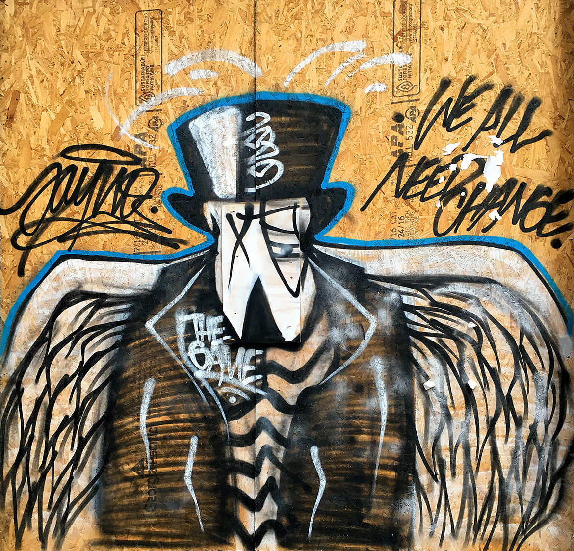 A spray paint cartoon bird wearing a black suit jacket, top hat and striped shirt with large white wings along with the phrase, "we all need change."